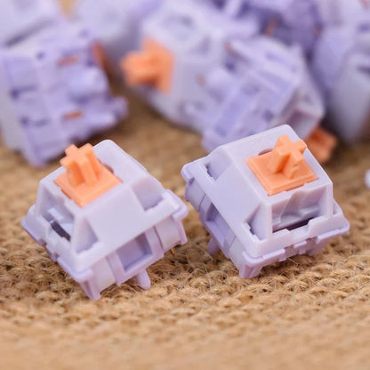 Switches táctiles MyKeyboard EPOMAKER Wisteria de color lila con stem naranja, ideales para teclados mecánicos.