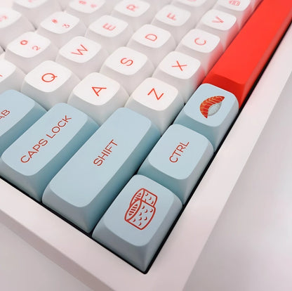Set de 140 keycaps MyKeyboard perfil XDA de PBT con diseño de salmón en tonos blanco y azul claro