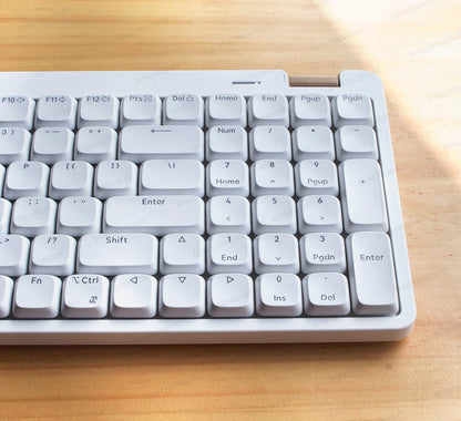 Teclado mecánico MyKeyboard Lofree Flow Lite 100 de perfil bajo en color blanco con pad numérico sobre mesa de madera