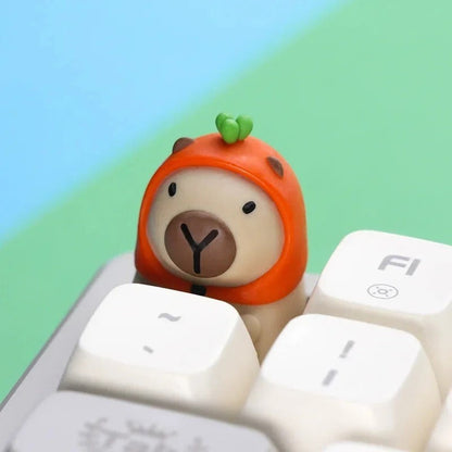 Tecla artesanal MyKeyboard con diseño de capibara con capucha naranja, compatible con switches mecánicos MX