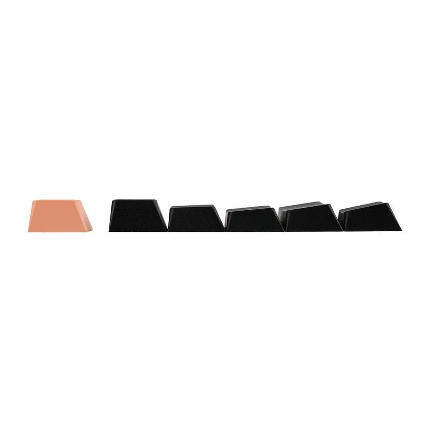 Teclas de repuesto para teclado mecánico MyKeyboard, una de color melocotón y cinco negras con perfil ergonómico.