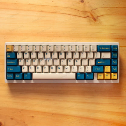 Teclado mecánico MyKeyboard Weikav NUT65 Merlin 65% con teclas PBT en tonos azul, crema y amarillo sobre madera